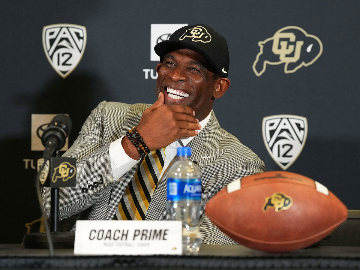 Deion Sanders smiles at his introductory presser at Colorado